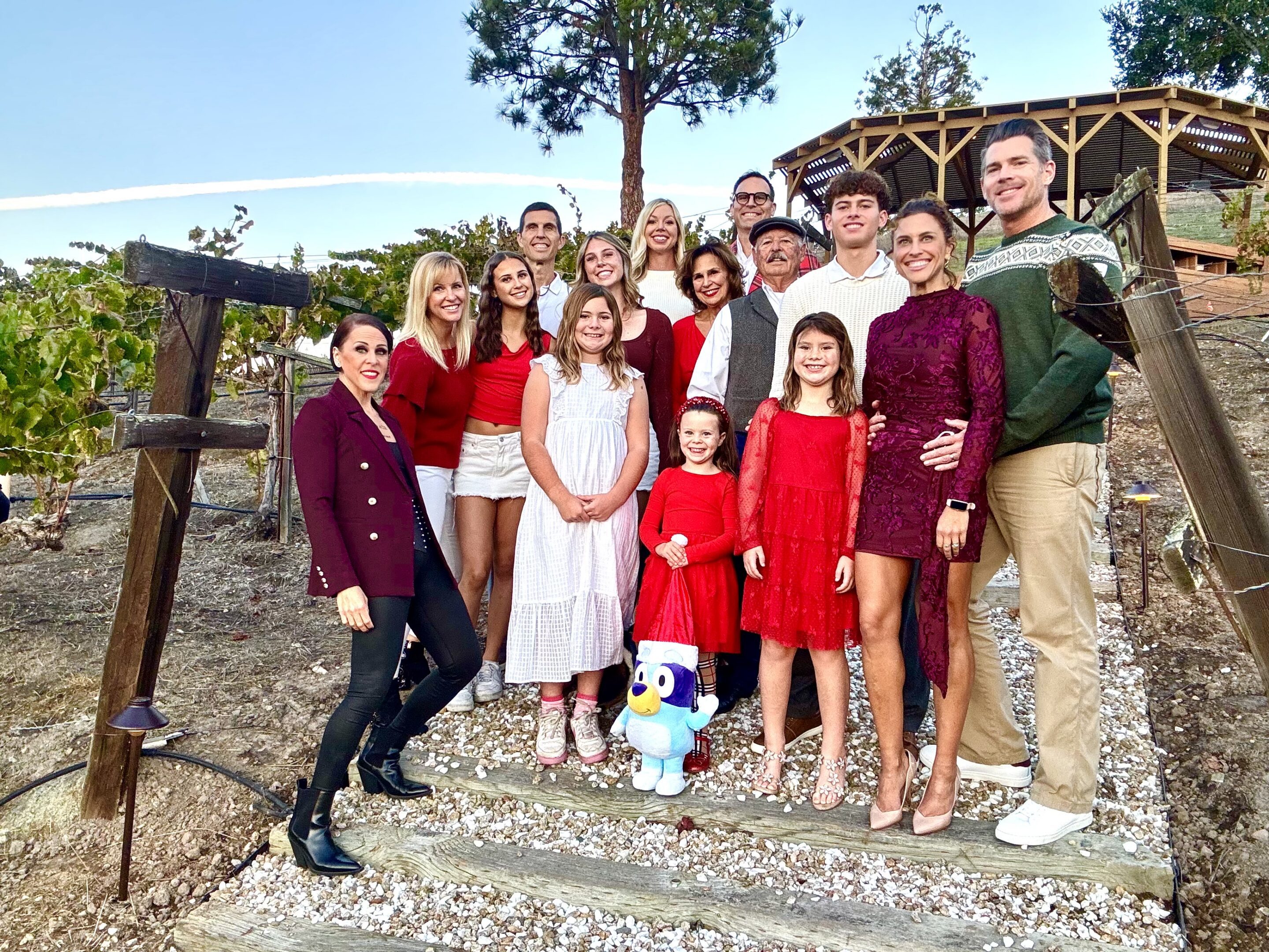 Multigenerational family group posing outdoors